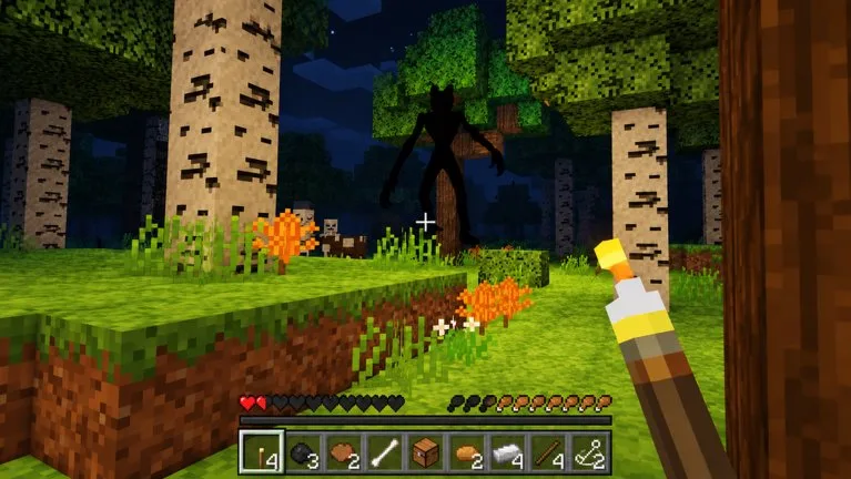 Official night screenshot: a tall black figure stands among birch trees while the player holds a torch.